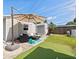 Inviting backyard with a patio seating area, putting green, and basketball hoop for outdoor entertainment at 5315 40Th N St, St Petersburg, FL 33714
