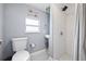 Updated bathroom features a walk-in shower, classic fixtures and neutral paint at 5315 40Th N St, St Petersburg, FL 33714