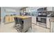 Bright, updated kitchen with island seating, stainless appliances, and ample cabinet space at 5315 40Th N St, St Petersburg, FL 33714