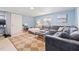 Comfortable living room showcasing a plush sofa and a stylish ottoman in a naturally lit space at 5315 40Th N St, St Petersburg, FL 33714