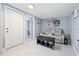 Cozy room with tile flooring, a comfortable seating area, and an adjacent bathroom at 5315 40Th N St, St Petersburg, FL 33714