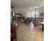 Bright living room with tile flooring, comfortable seating, and abundant natural light at 5811 White Oak Bayou Ct, Bradenton, FL 34203