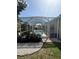 Screened-in lanai and pool area with a well-maintained pebble and garden space at 5811 White Oak Bayou Ct, Bradenton, FL 34203
