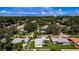 This aerial view captures the property's fenced yard and neighborhood setting at 717 Pinewood Dr, Dunedin, FL 34698