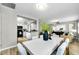 Bright dining area with views of the kitchen and living spaces, perfect for entertaining at 717 Pinewood Dr, Dunedin, FL 34698