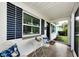 Inviting front porch with stylish decor and a welcoming entrance at 717 Pinewood Dr, Dunedin, FL 34698