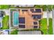 Aerial of home featuring a backyard pool and solar panels on the roof at 9707 Kings Canyon Pl, Tampa, FL 33634