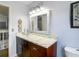 Bathroom featuring a clear glass bowl sink, marble countertop, and wooden vanity at 9707 Kings Canyon Pl, Tampa, FL 33634
