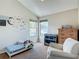 Bright bedroom with vaulted ceilings, decorative wall art, two windows, and neutral paint at 9707 Kings Canyon Pl, Tampa, FL 33634