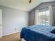Bedroom with a bed and window at 9707 Kings Canyon Pl, Tampa, FL 33634