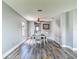 Bright dining room features hardwood floors and a contemporary ceiling fan at 9707 Kings Canyon Pl, Tampa, FL 33634
