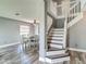 Dining room featuring a white table with seating for six, light gray walls, and wood floors at 9707 Kings Canyon Pl, Tampa, FL 33634