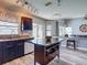Modern kitchen with a kitchen island and bar seating at 9707 Kings Canyon Pl, Tampa, FL 33634
