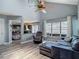 Living room boasts high ceilings, hardwood floors, and seamless flow to the kitchen at 9707 Kings Canyon Pl, Tampa, FL 33634