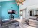 The living room offers high ceilings, hardwood floors and is filled with natural light at 9707 Kings Canyon Pl, Tampa, FL 33634