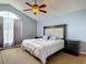 Bedroom featuring a window and padded headboard at 9707 Kings Canyon Pl, Tampa, FL 33634