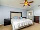 Bedroom with vaulted ceilings, ceiling fan, and carpeted floors at 9707 Kings Canyon Pl, Tampa, FL 33634