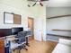 Office space featuring wood floors, computer and two wall-mounted boards at 9707 Kings Canyon Pl, Tampa, FL 33634