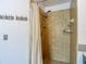 Shower with tile walls, and multiple shower heads at 9707 Kings Canyon Pl, Tampa, FL 33634
