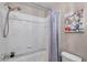 Bright bathroom features a shower-tub combination with a white tile surround at 1000 W Horatio St # 129, Tampa, FL 33606
