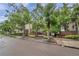 Hyde Park Place entrance featuring lush trees and landscaping creating a welcoming and serene atmosphere at 1000 W Horatio St # 129, Tampa, FL 33606