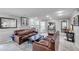 Inviting common space featuring sofas, a fireplace, and large windows for natural light at 1000 W Horatio St # 129, Tampa, FL 33606