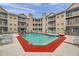 Community pool surrounded by lounge chairs, offering a perfect spot for relaxation and recreation at 1000 W Horatio St # 129, Tampa, FL 33606