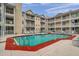 Community pool featuring easy ladder access and plenty of seating for residents at 1000 W Horatio St # 129, Tampa, FL 33606