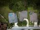 Aerial view of home, showcasing the pool, landscaping, driveway, and neighborhood layout at 1137 Pristine Pl, Lutz, FL 33549