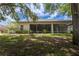 Lovely backyard with a screened lanai and ceiling fans for relaxing outdoor living at 1137 Pristine Pl, Lutz, FL 33549