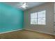 Bright bedroom with a window, ceiling fan, and carpeted floors at 1137 Pristine Pl, Lutz, FL 33549