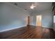 Spacious bedroom with wood floors, light-blue walls, and ceiling fan at 1137 Pristine Pl, Lutz, FL 33549