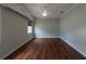Empty bedroom features hardwood floors, one window, and a ceiling fan at 1137 Pristine Pl, Lutz, FL 33549