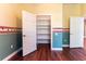 Bedroom with a large closet and adjacent doorway at 1137 Pristine Pl, Lutz, FL 33549