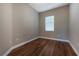 Small bedroom with hardwood floors and window at 1137 Pristine Pl, Lutz, FL 33549