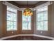 Breakfast nook with large windows and unique light fixture at 1137 Pristine Pl, Lutz, FL 33549