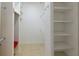 Organized walk-in closet with tiled floors and ample shelf space at 1137 Pristine Pl, Lutz, FL 33549