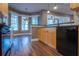 Bright kitchen features wood cabinets and black appliances, with a breakfast nook in view at 1137 Pristine Pl, Lutz, FL 33549