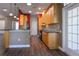 Eat-in kitchen with stainless steel appliances, wood cabinets and a breakfast bar at 1137 Pristine Pl, Lutz, FL 33549