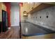 Bright kitchen showcasing wood cabinets, backsplash detail, and dark countertops at 1137 Pristine Pl, Lutz, FL 33549