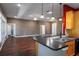 Spacious living room and kitchen area featuring a breakfast bar and modern finishes at 1137 Pristine Pl, Lutz, FL 33549