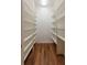 Walk-in pantry offers plenty of storage with floor-to-ceiling shelving units at 1137 Pristine Pl, Lutz, FL 33549