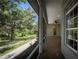 Screened-in porch with tile floors and an inviting view at 1137 Pristine Pl, Lutz, FL 33549