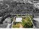 Black and white aerial view of the home at 116 Hermes Rd Venice, FL 34293 with a metal roof at 116 Hermes Rd, Venice, FL 34293