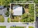 Aerial view of the home at 116 Hermes Rd Venice, FL 34293 with a new metal roof and fenced in yard at 116 Hermes Rd, Venice, FL 34293