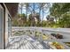 Backyard deck with railing and trees behind the backyard fence at 116 Hermes Rd, Venice, FL 34293