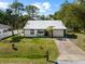 Front exterior featuring a new metal roof and fenced yard at 116 Hermes Rd, Venice, FL 34293