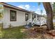 View of the home's exterior and wooden deck at 116 Hermes Rd, Venice, FL 34293