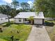 Front exterior featuring a new metal roof and fenced yard at 116 Hermes Rd, Venice, FL 34293