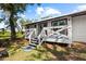 View of the home's deck and sliding doors to the back yard at 116 Hermes Rd, Venice, FL 34293